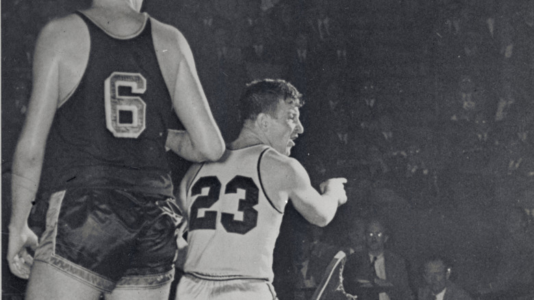 Gene Melchiorre plays basketball and points