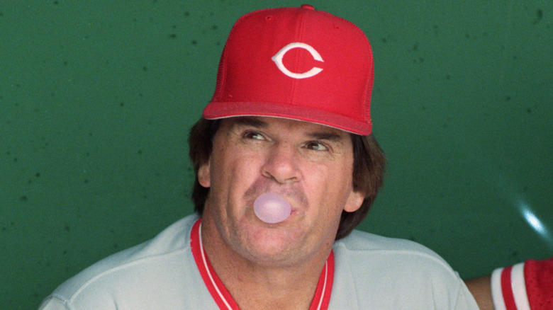 Pete Rose blows gum bubble in dugout
