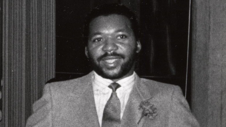 Darryl Stingley in suit beard smiling