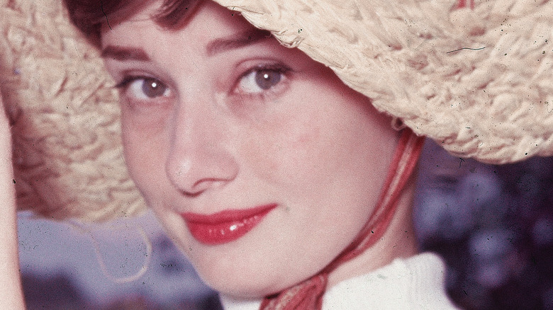 Audrey hepburn holding fishing net