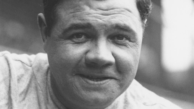 George Herman "Babe" Ruth Jr. grins