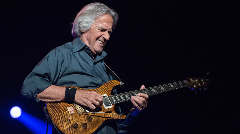 John McLaughlin playing guitar live