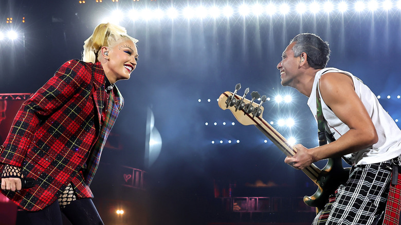 Gwen Stefani and Tony Kanal performing on stage