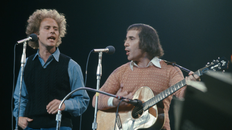 Art Garfunkel and Paul Simon performing in concert