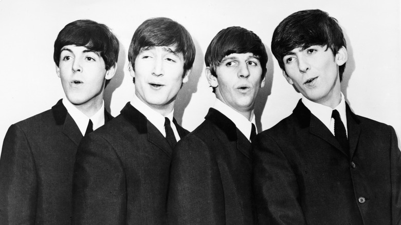 Black and white photo of Paul McCartney, John Lennon, Ringo Starr, and George Harrison of The Beatles