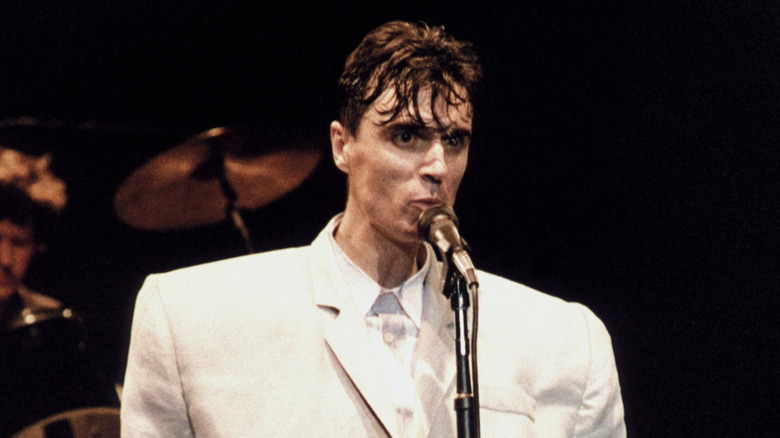 David Byrne wearing an oversized suit while performing with Talking Heads
