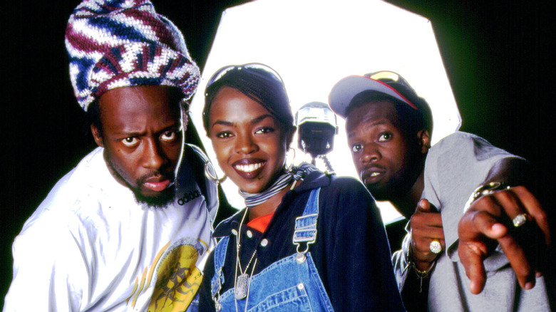 staged portrait of the fugees together by studio light