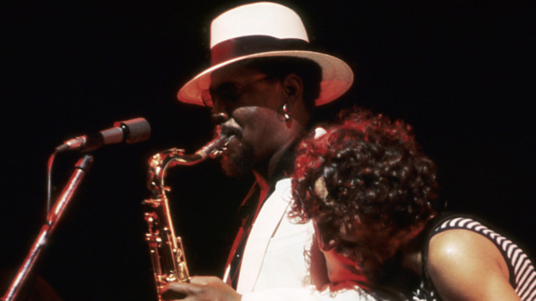 Clarence Clemons playing while Bruce Springsteen looks on