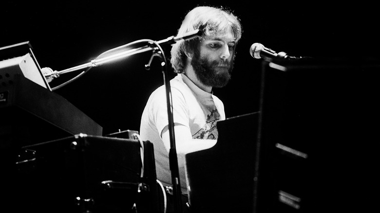 Bearded Keith Godchaux playing keyboards on stage
