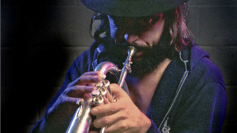 Chuck Mangione playing the flugelhorn in a hat