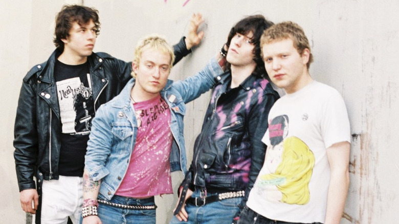 Exploding Hearts leaning on wall in 2000s publicity picture