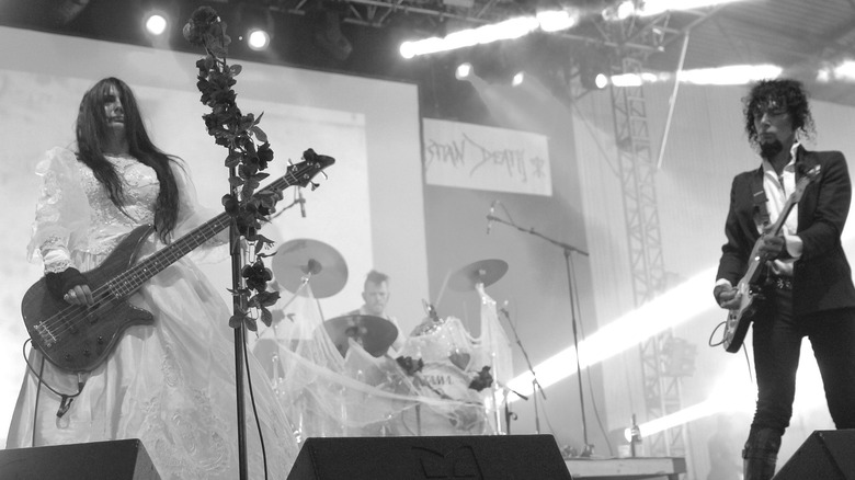Christian Death on stage in wedding dress and guitars