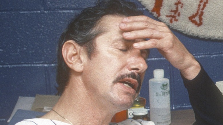Billy Martin with hand on forehead