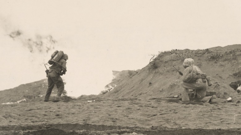 Marine shooting flamethrower in battle