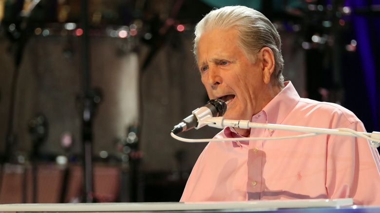 Brian Wilson singing at piano