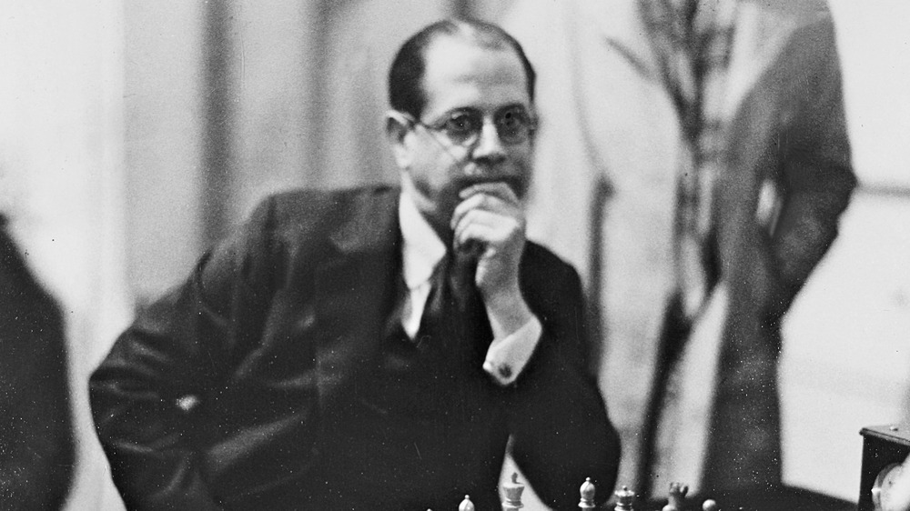 Jose Raul Capablanca with hand on chin