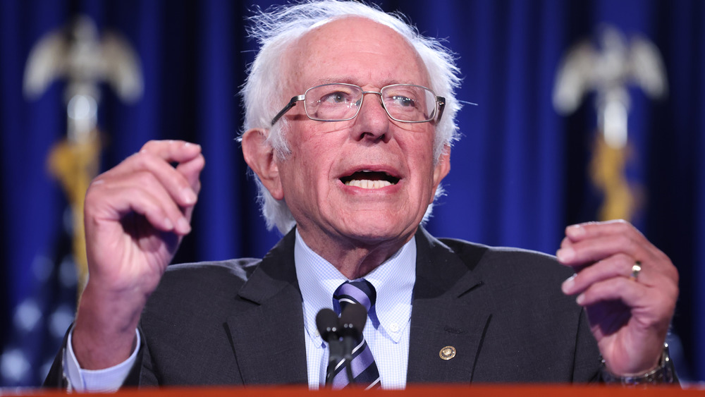 Bernie Sanders speaking at podium 