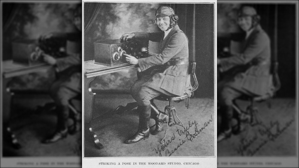 Bessie Coleman seated at a radio