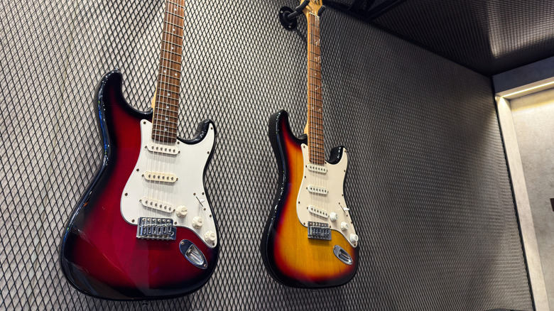 Fender Stratocasters hanging on wall