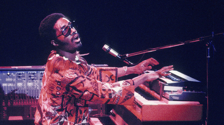 Stevie Wonder singing and playing keyboard