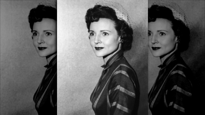 Betty White posing for a photo in 1955