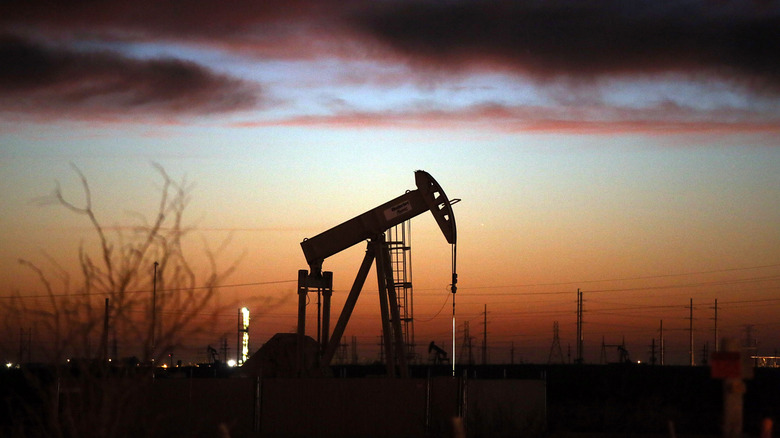 Oil derrick at sunset