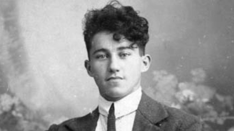 Young Adi Dassler wearing a suit
