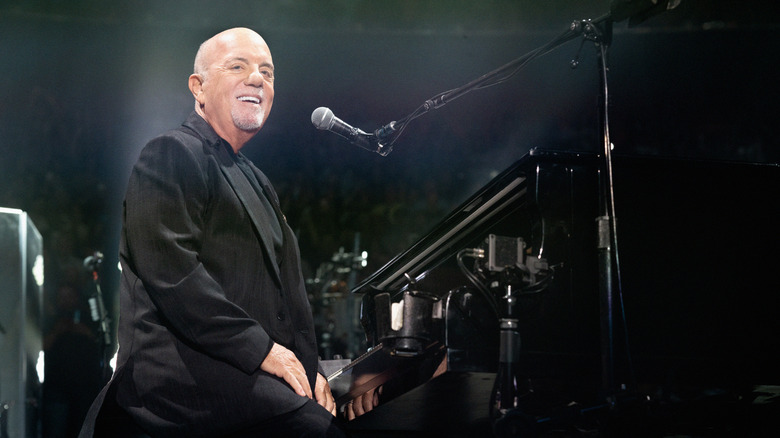 Billy Joel at the piano performing in concert