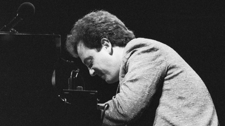 Billy Joel playing piano black and white