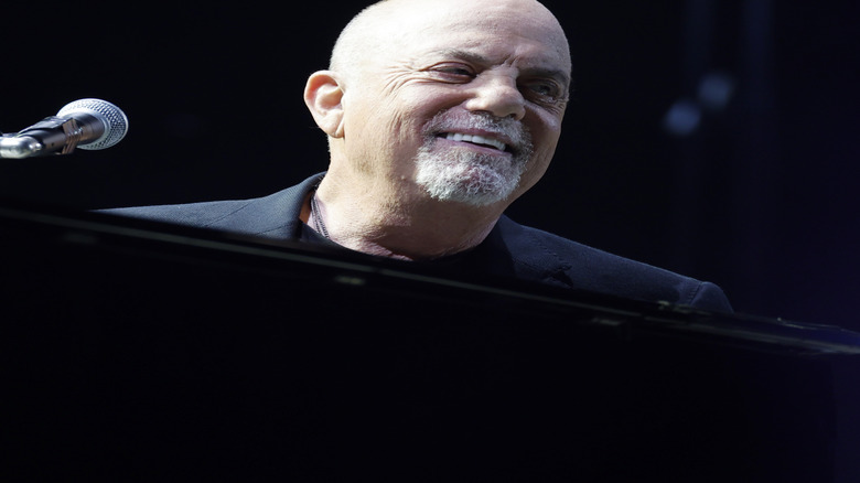 Billy Joel smiling looking to side