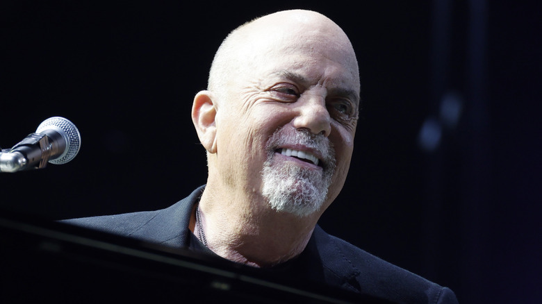 Billy Joel smiling looking to side