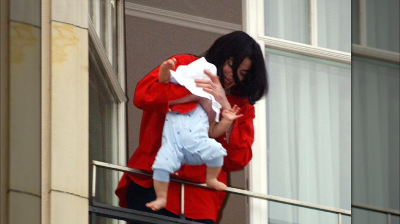 Michael Jackson with baby on balcony