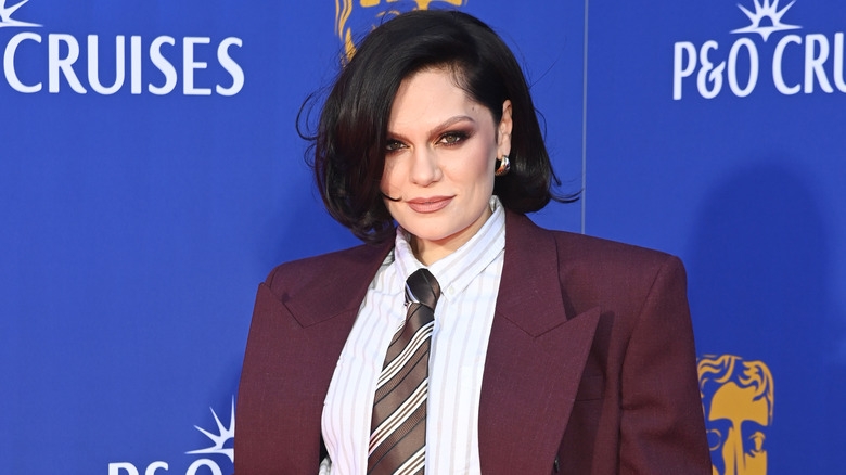 Jessie J wearing a suit and posing for a photo at the 2025 BAFTAs