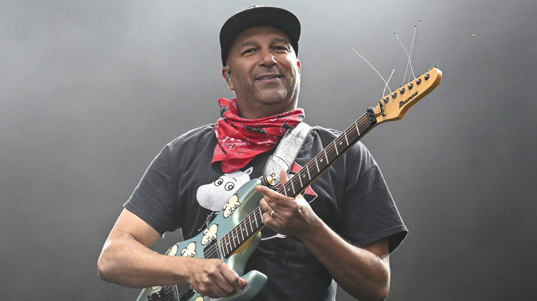 Tom Morello playing guitar on stage in 2025