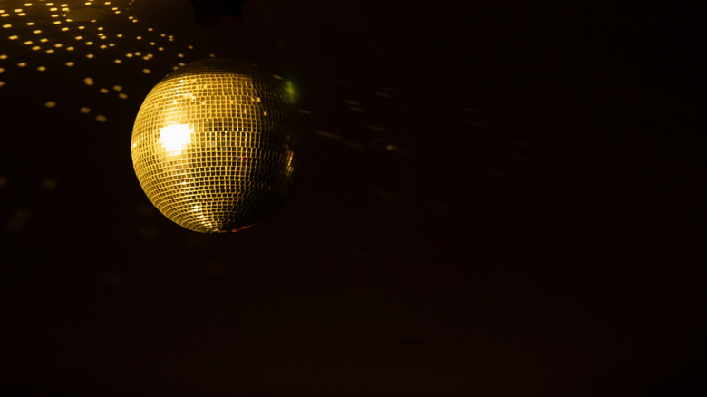 gold disco ball and reflected light