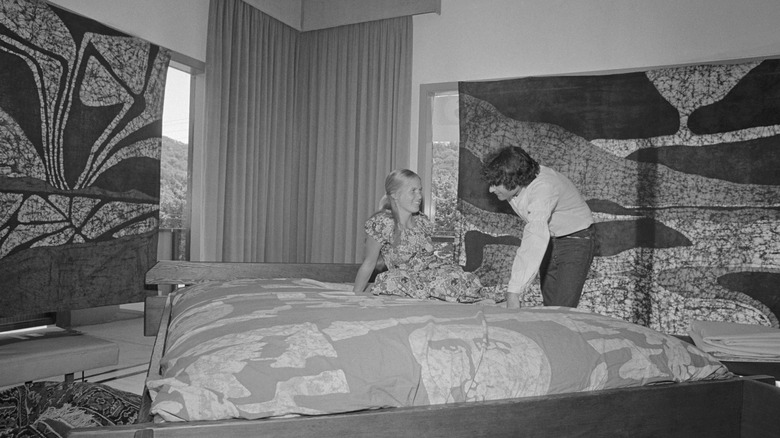 young woman getting a waterbed sales pitch