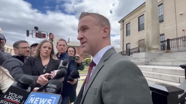 Aidan Kearney speaking to reporters outside Norfolk County Courthouse, 2025