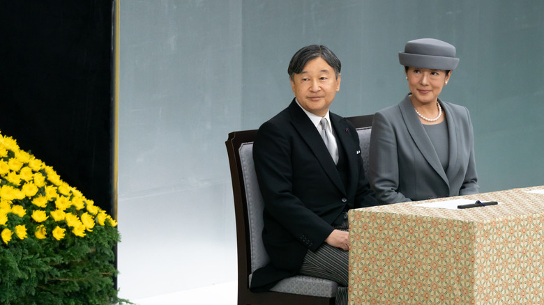emperor and empress of japan at a ceremony
