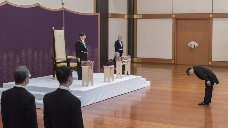 japanese emperor receiving wrapped imperial regalia