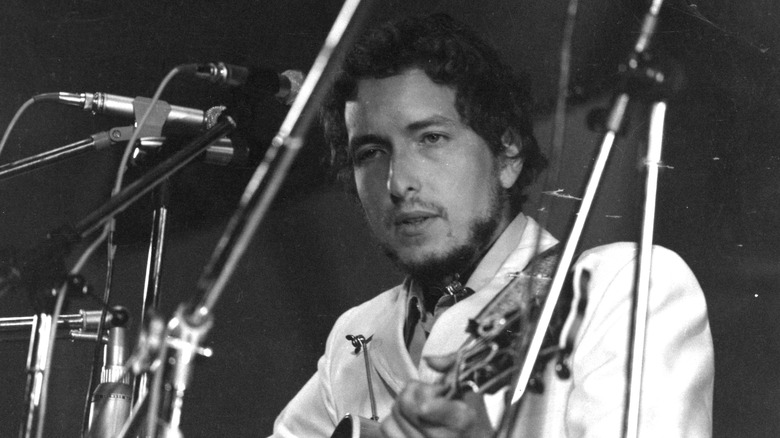 Bob Dylan playing into set of  mics