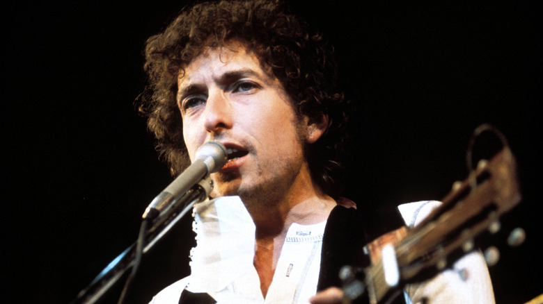 Bob Dylan performing on stage