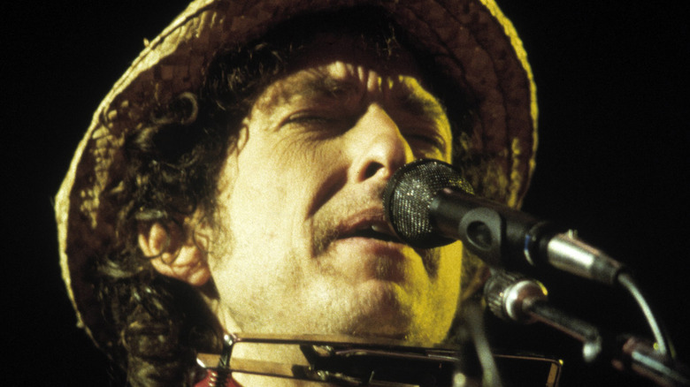 Bob Dylan singing into microphone