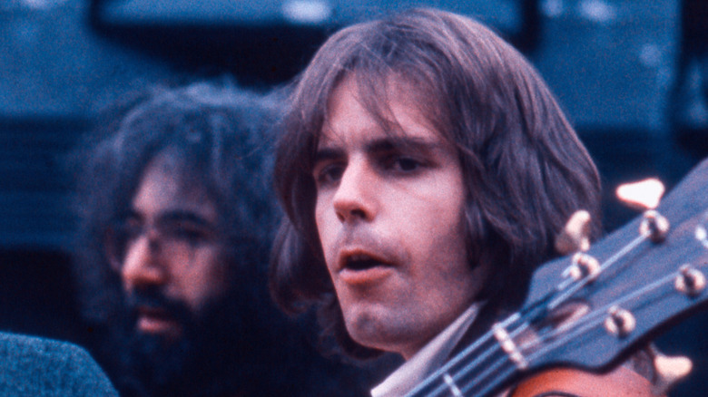 Bob Weir onstage, with Jerry Garcia in the backbround
