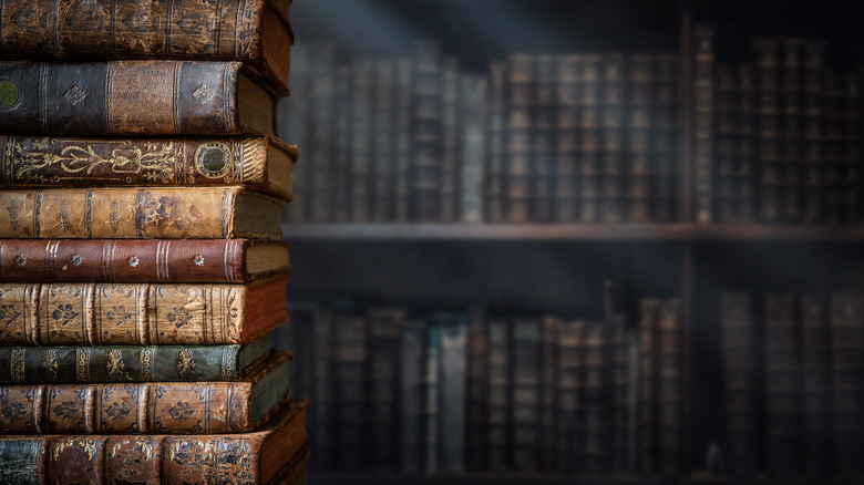 Old books stacked on table