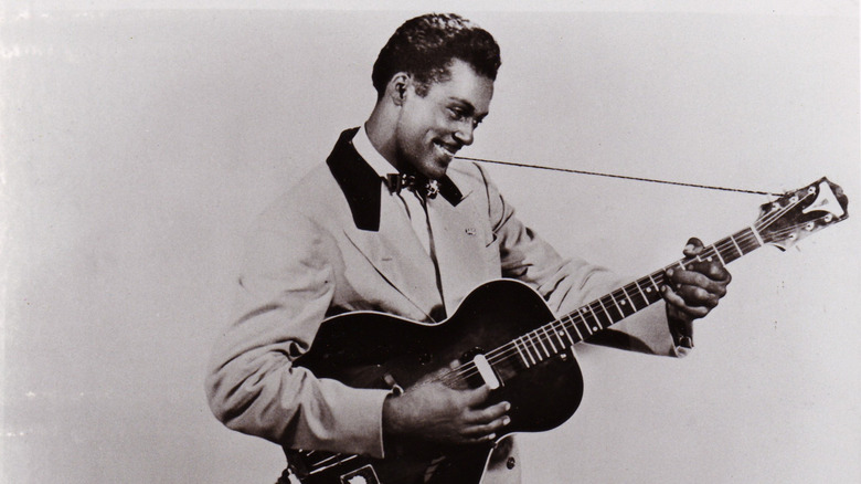 Chuck Berry posing for photo with guitar
