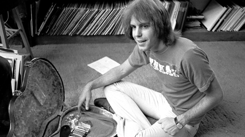 Bob Weir sitting with guitar