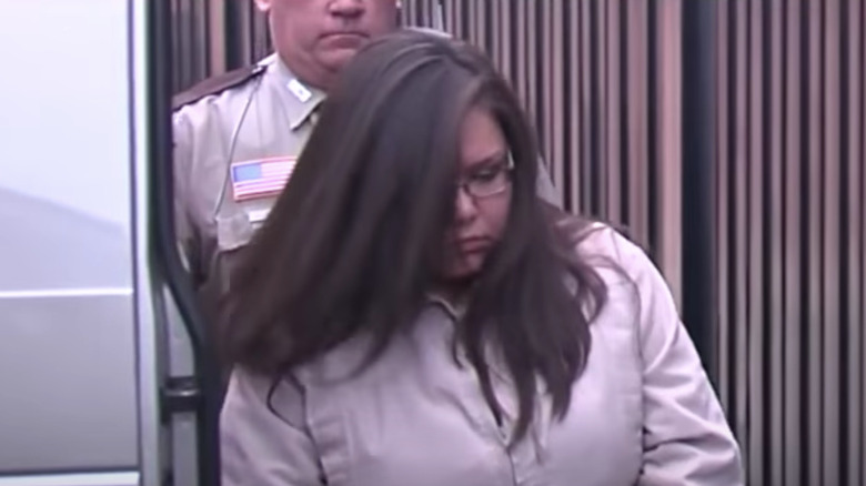 Brandi Worley being escorted