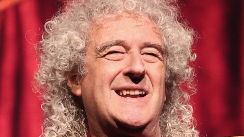 Brian May smiling