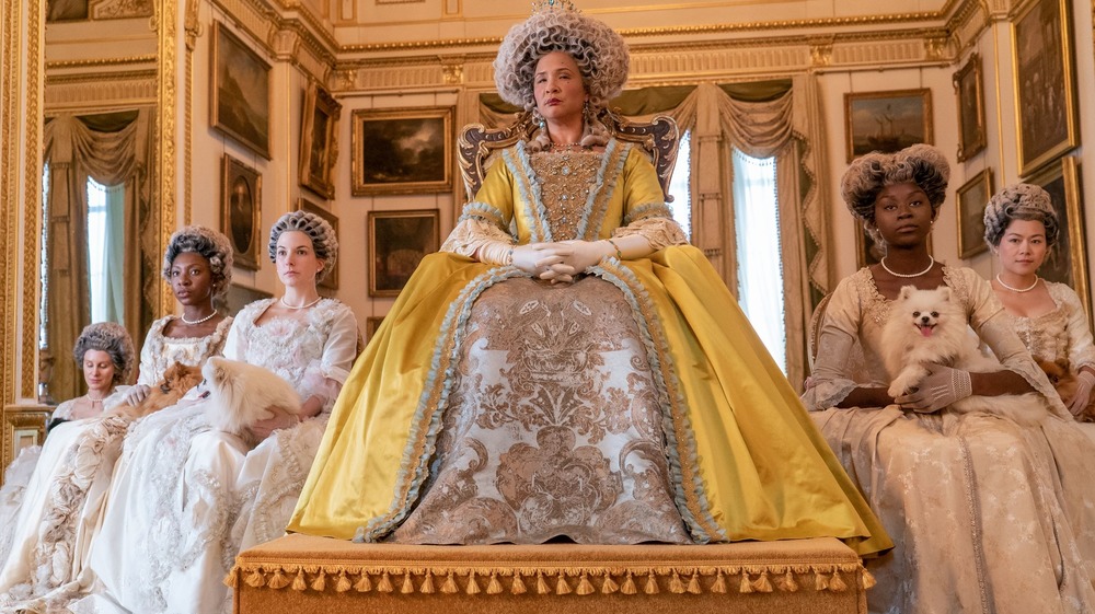 Bridgerton's Queen Charlotte gold gown on throne