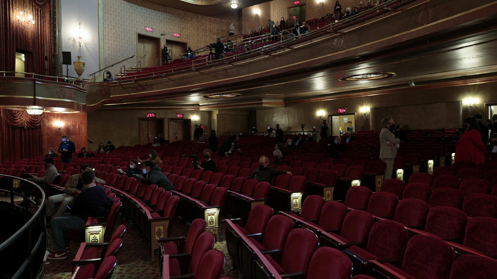 People seated in Broadway theater